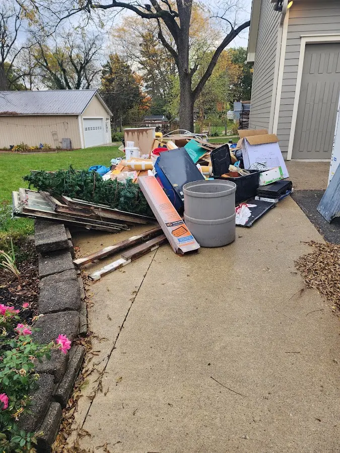 Dumpster being loaded with debris for Demolition Dumpster Rental in Moreland Hills
